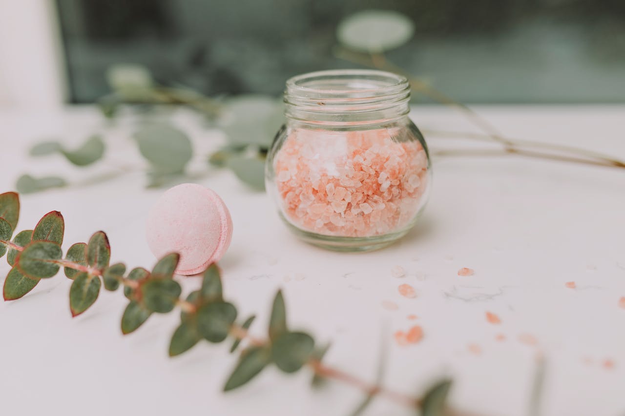 services-02 Calming spa scene featuring pink bath salt and eucalyptus for a relaxing experience.
